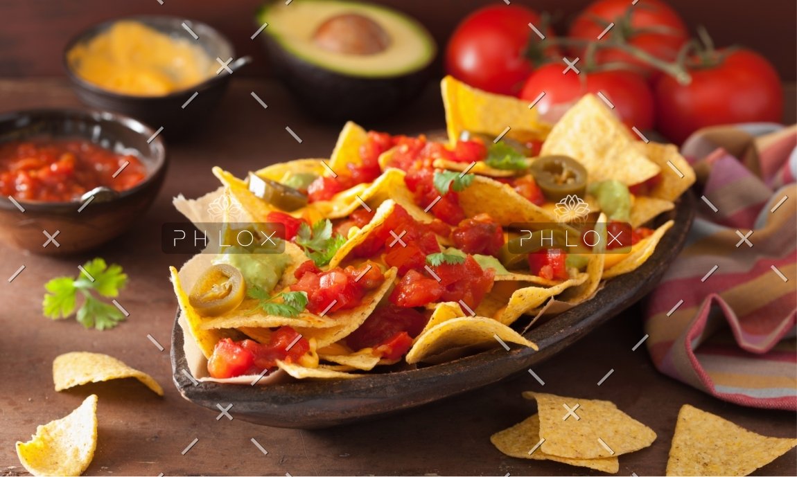 demo-attachment-1166-nachos-loaded-with-salsa-guacamole-cheese-and-P7GUFN7